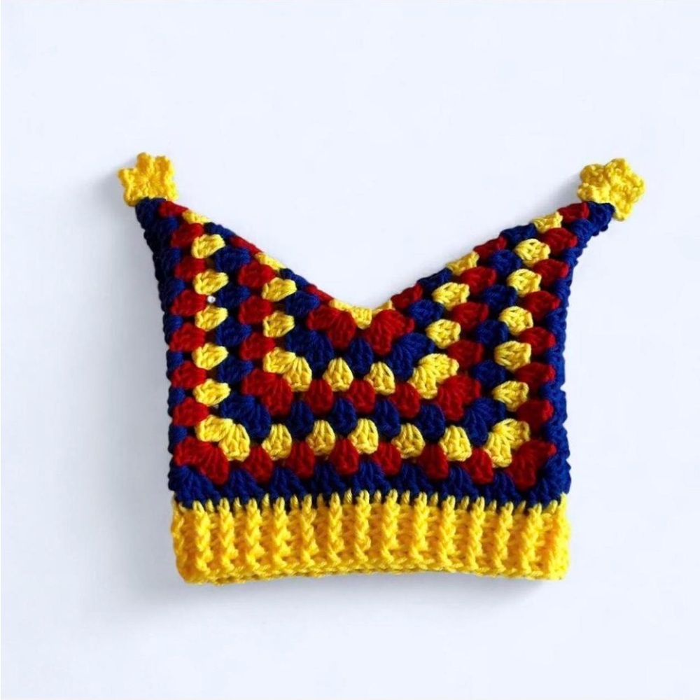 crochet yellow, red, and blue primary color jester hat with mini yellow stars